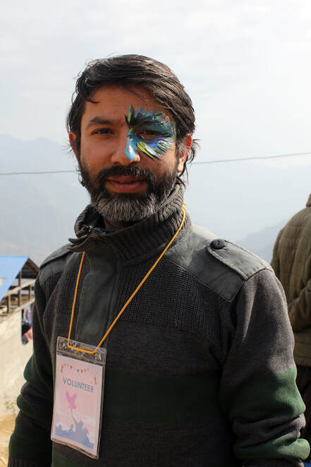 Yadav Ghimirey wearing owl-themed face paint